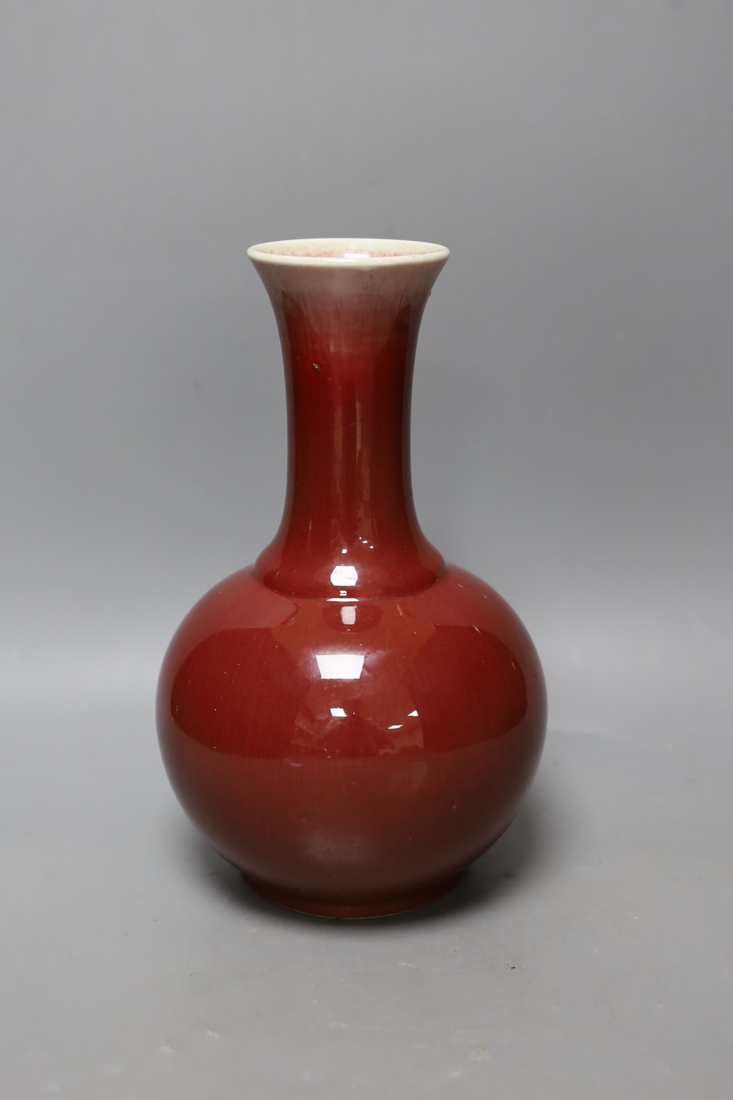 A Chinese ox blood bottle vase, mark to base 27cm